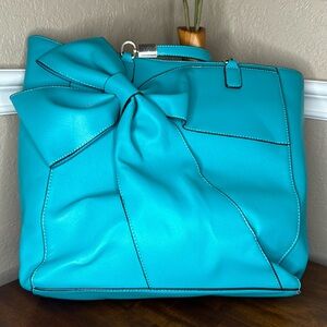 Boutique, turquoise bow tote with silver hardware